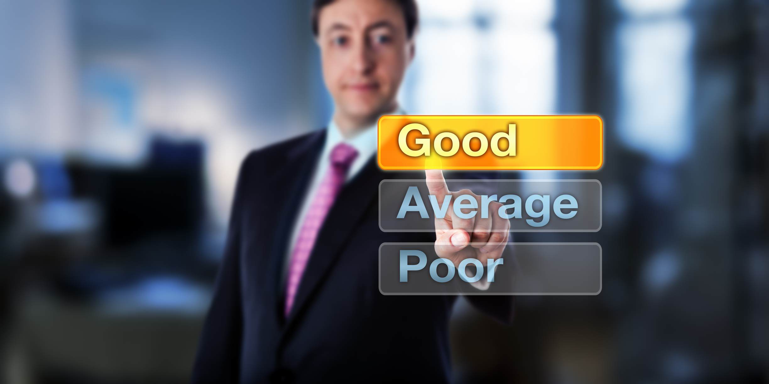 Man pointing at a 'good' sign, with average and poor underneath